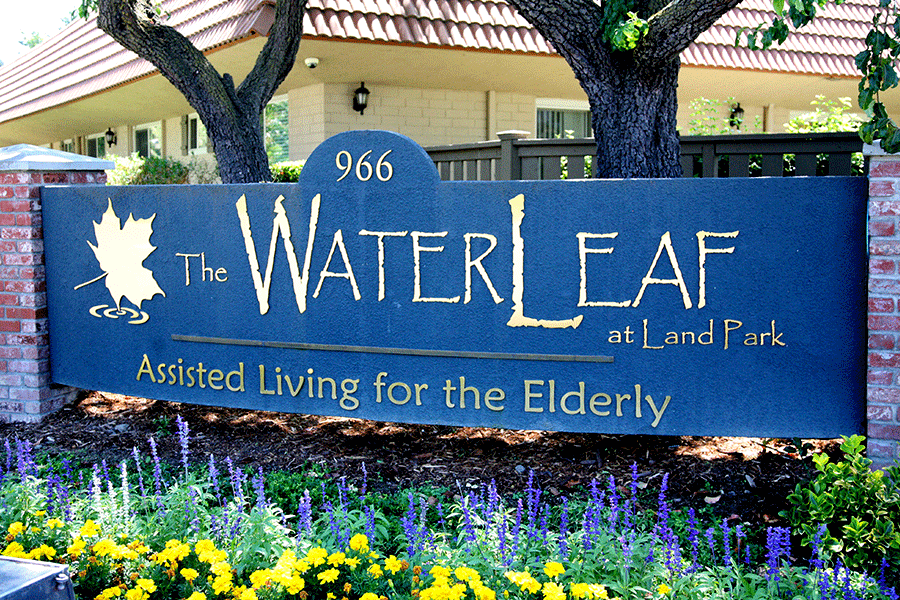 Monument sign with polished brass sign letters and elements.