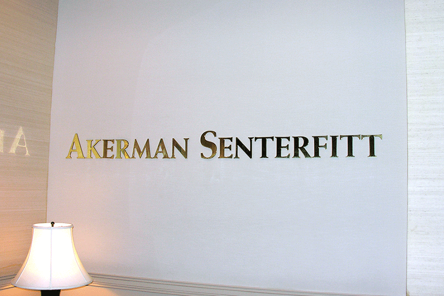 Law office sign with polished brass sign letters.