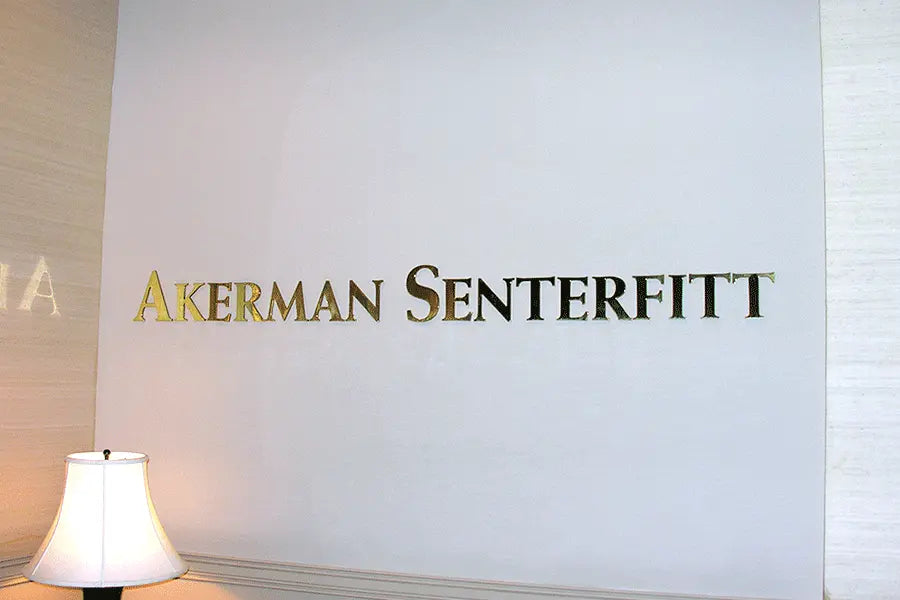 Law office sign with polished brass sign letters.