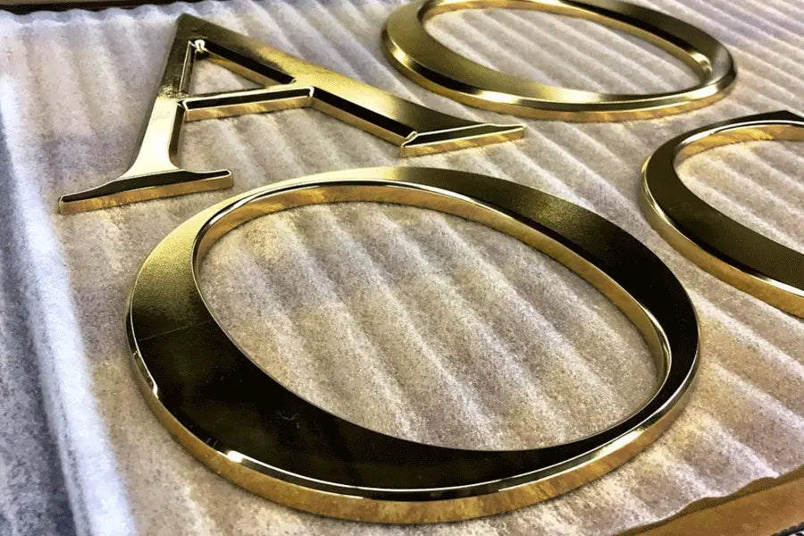 Closeup of polished brass sign letters