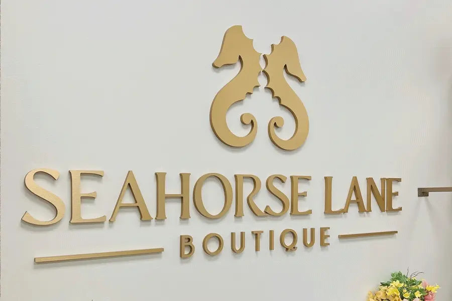 Seahorse Lane Boutique sign made from brushed bronze sign letters