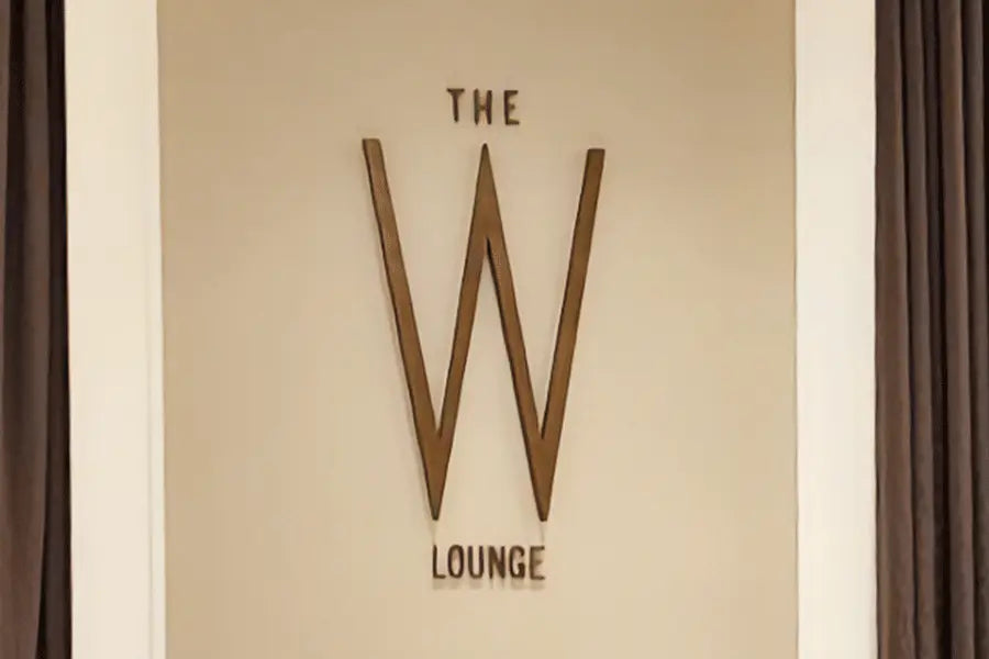 Restaurant sign with aged bronze sign letters.