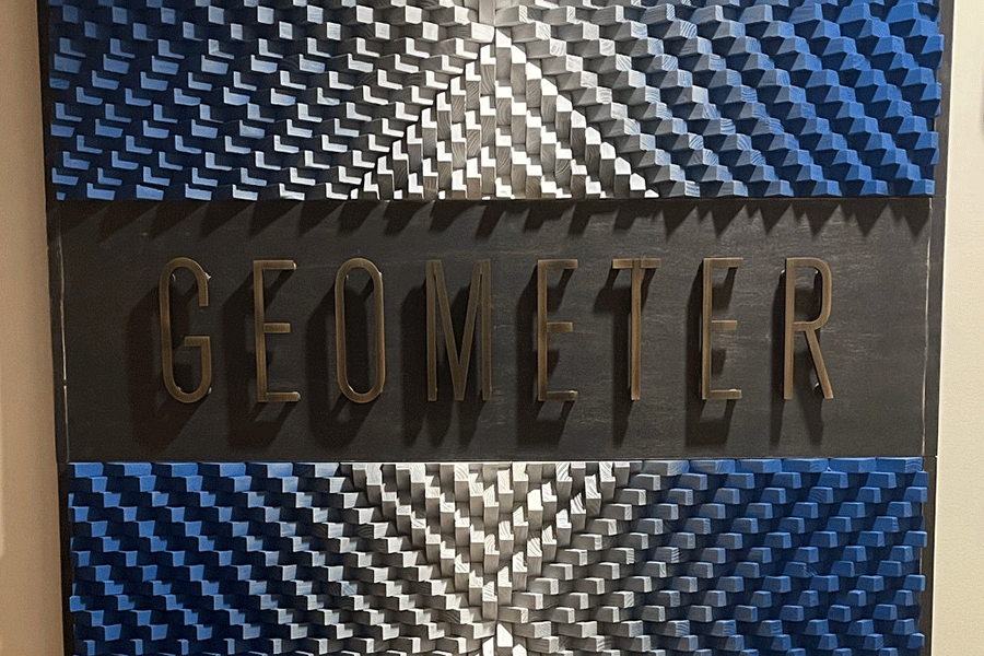 Interior wall sign with aged bronze sign letters.