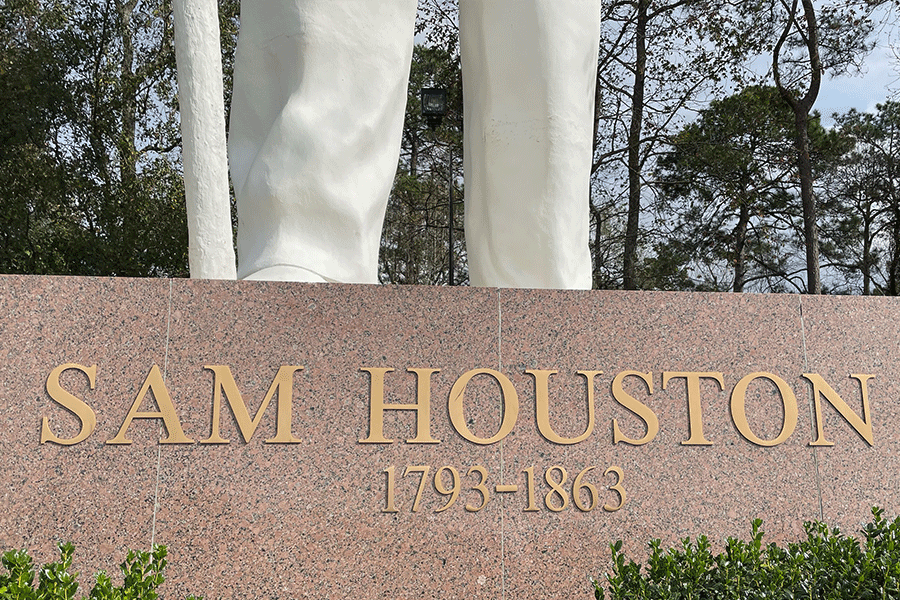 Monument sign with bronze sign letters and numbers.