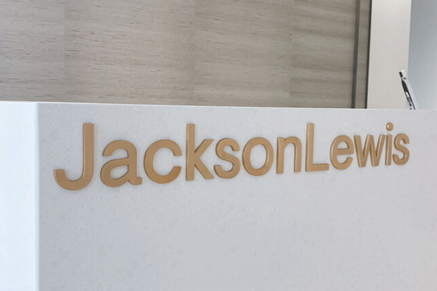 Lobby sign with polished bronze sign letters.