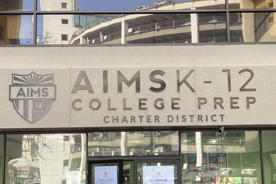 An exterior building sign with aged bronze sign letters.