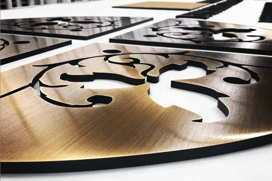 Flat cut aged bronze signs