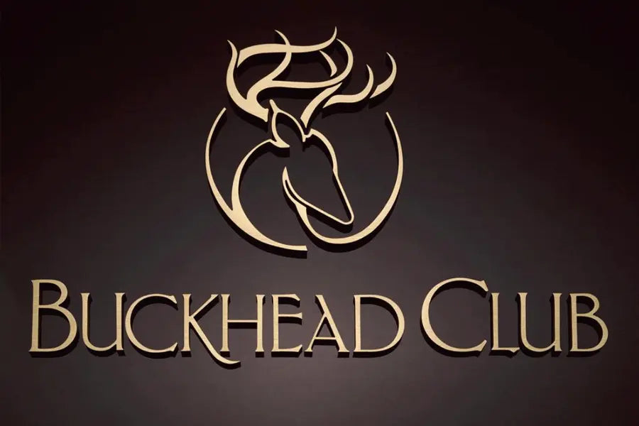 Buckhead Club sign in flat cut brushed bronze sign letters