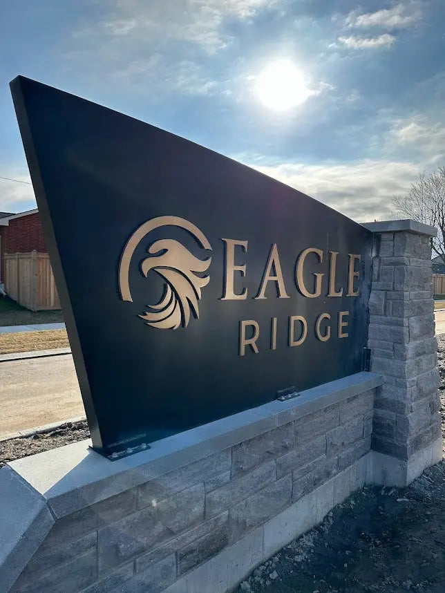 Monument sign with flat cut brushed bronze letters