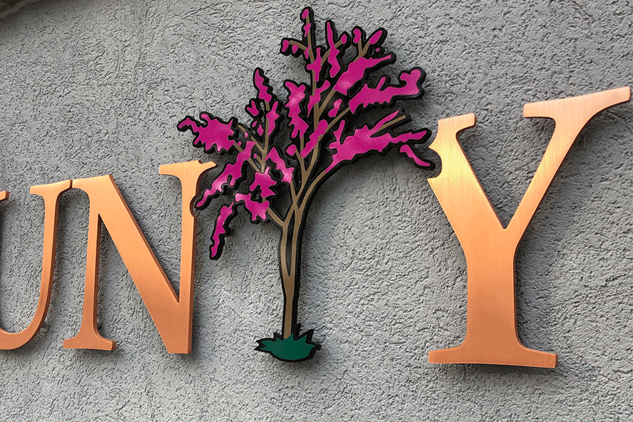 Country club sign with copper sign letters and painted metal elements.