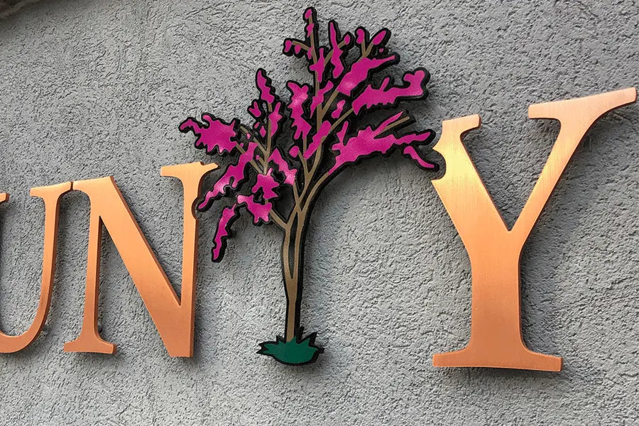 Country club sign with copper sign letters and painted metal elements.