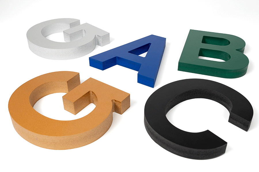 Close-up of plastic PVC sign letters in a variety of colors.