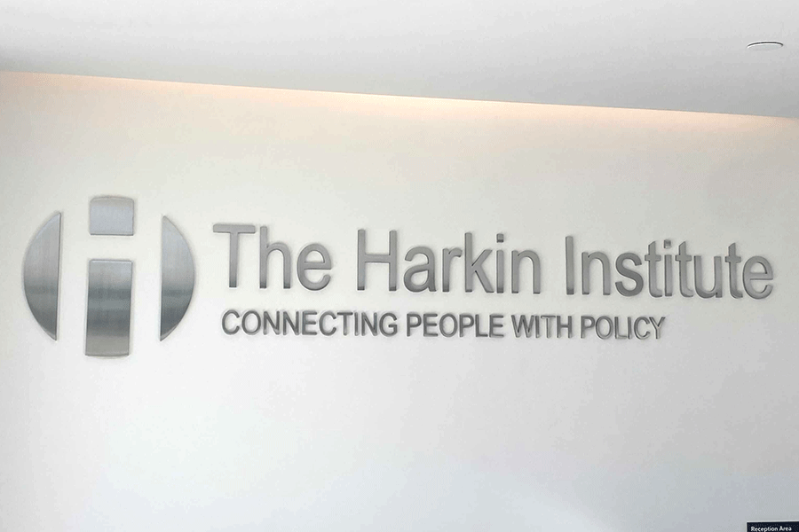 Lobby sign with polished stainless steel sign letters.
