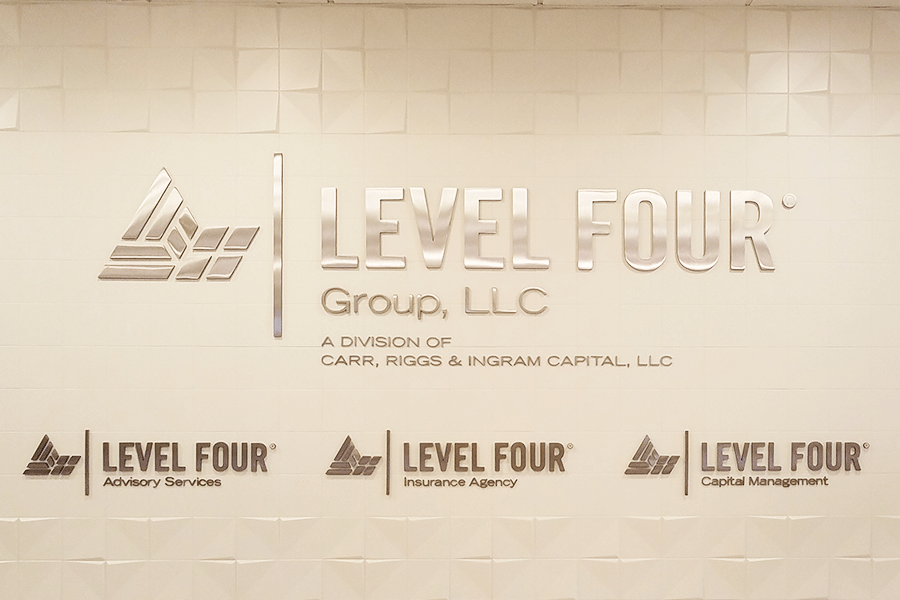 Agency sign with polished stainless steel sign letters and shapes.