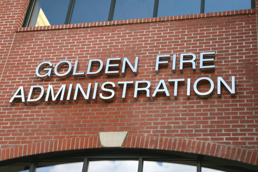 Fire station sign with polished stainless steel sign letters.