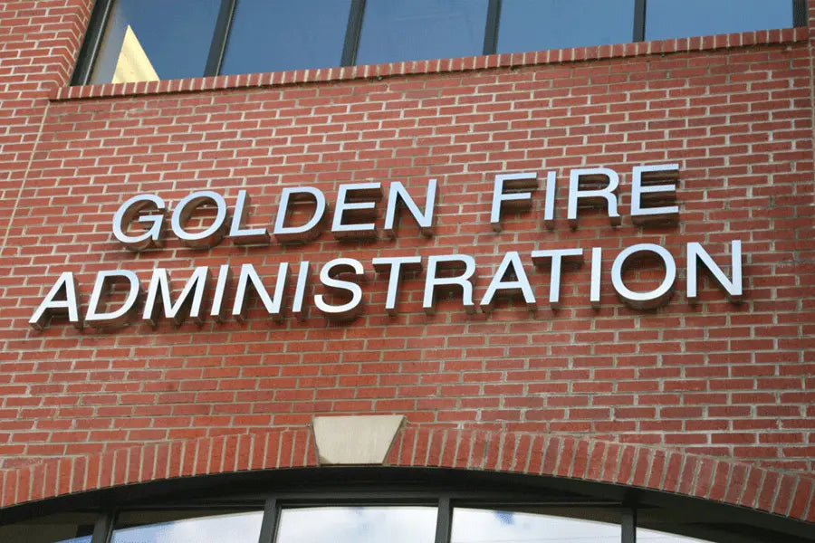 Fire station sign with polished stainless steel sign letters.