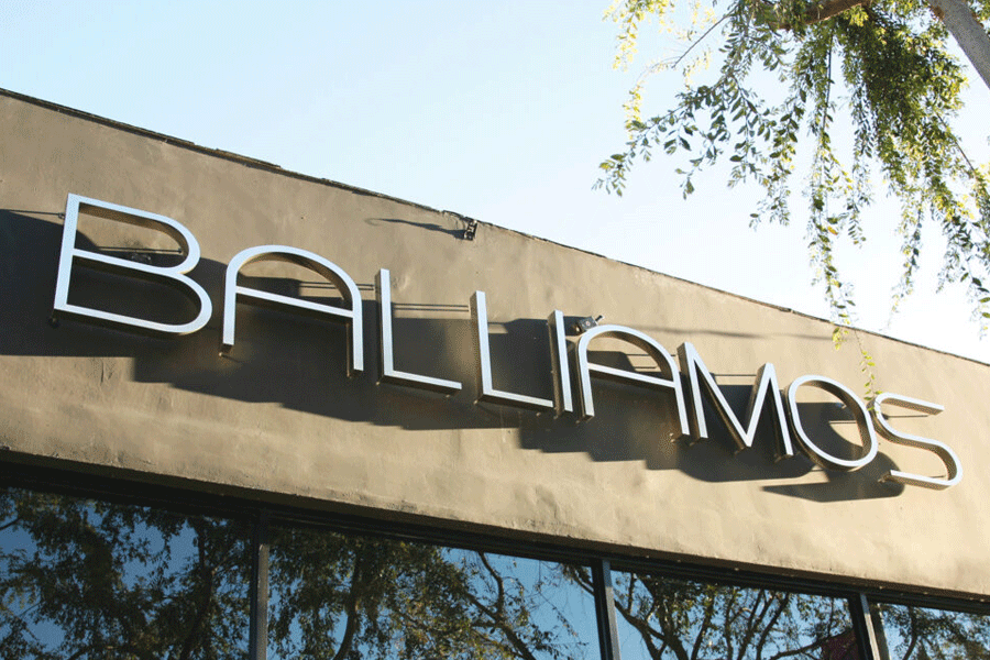 Restaurant sign with polished stainless steel sign letters.