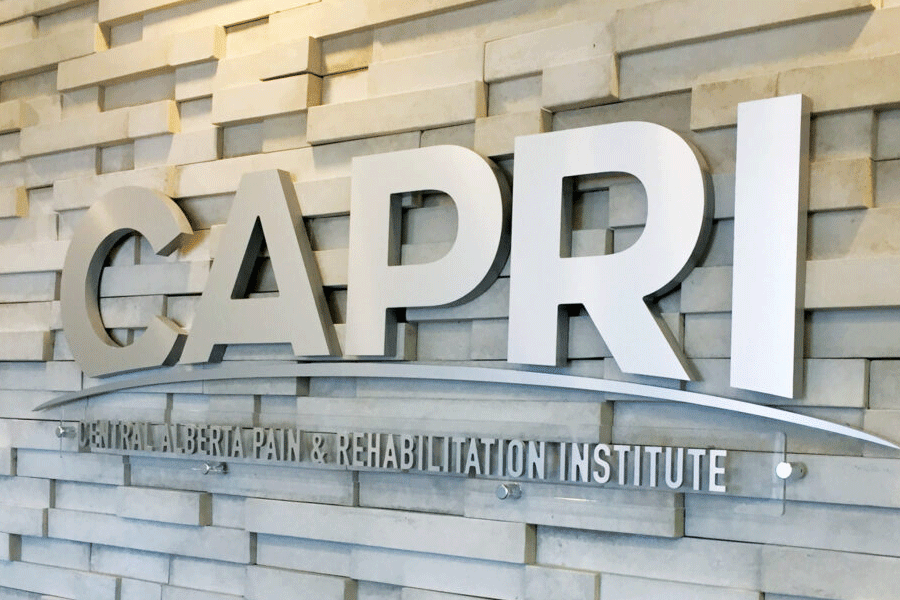 Doctor's office sign with brushed stainless steel sign letters.