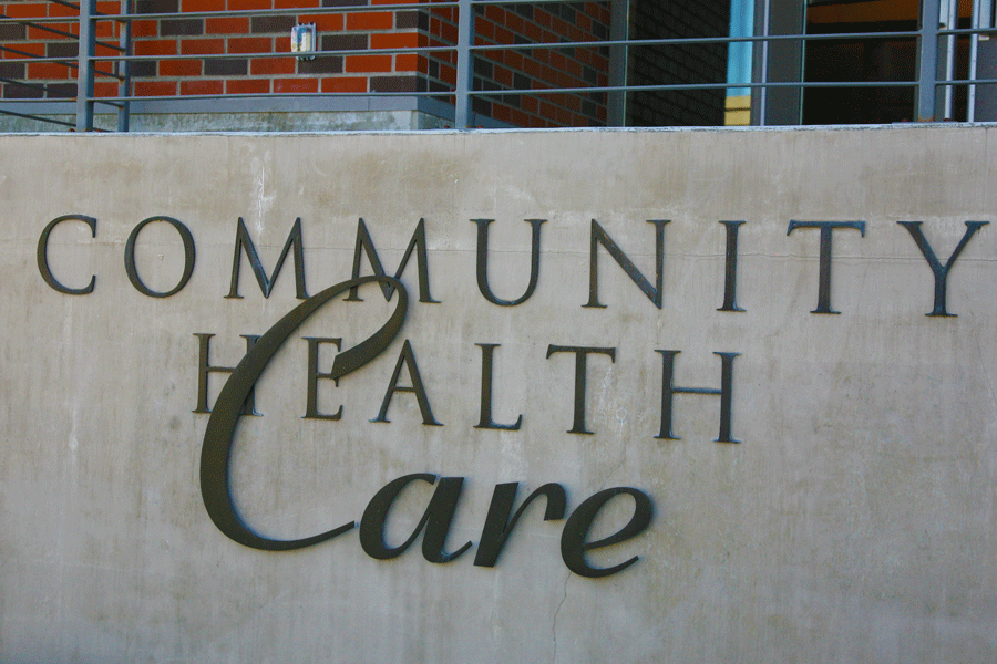 An exterior building sign with either aged bronze or weathered steel sign letters.