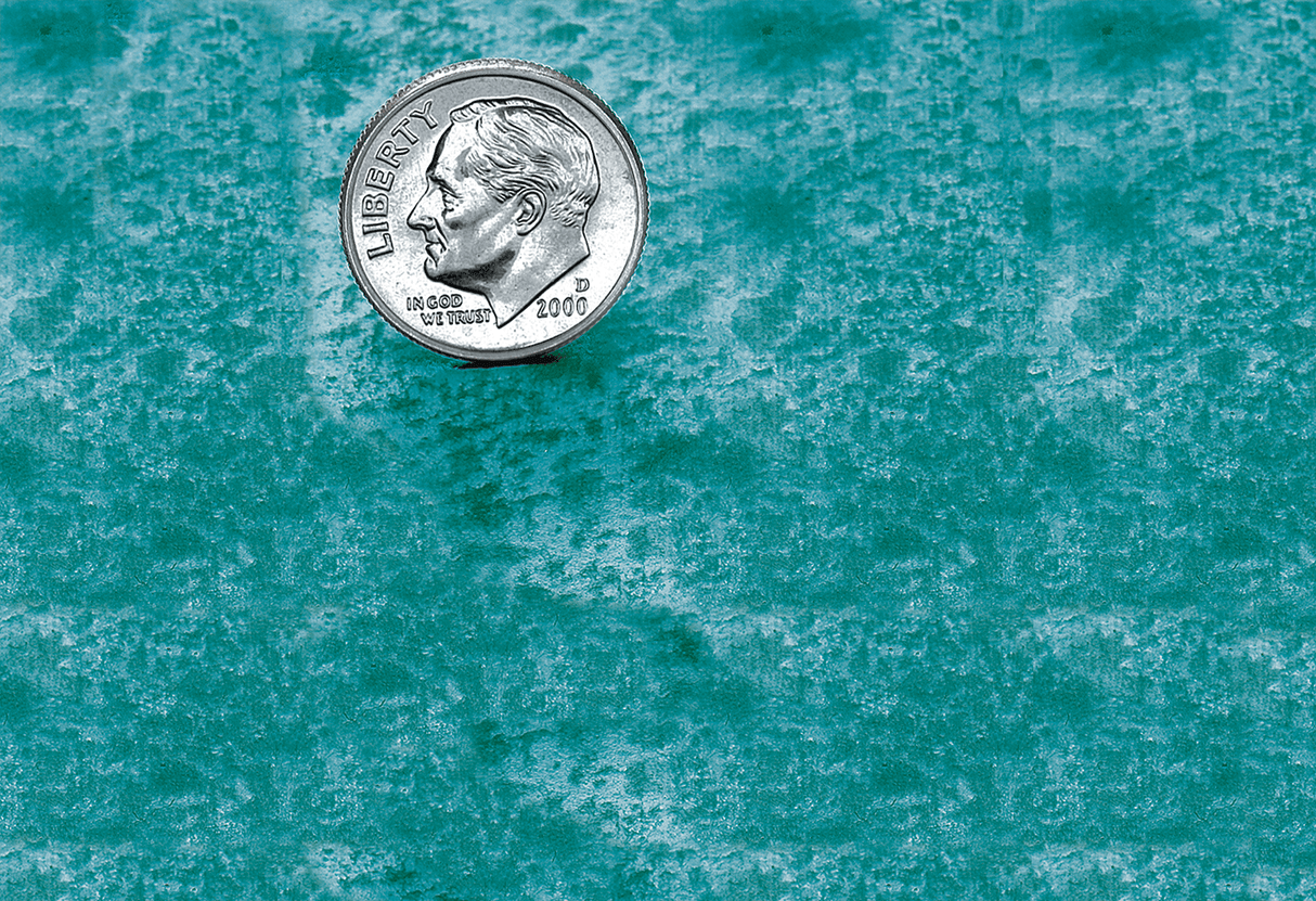 Sample of a turquoise bronze or brass patina finish for sign letters.