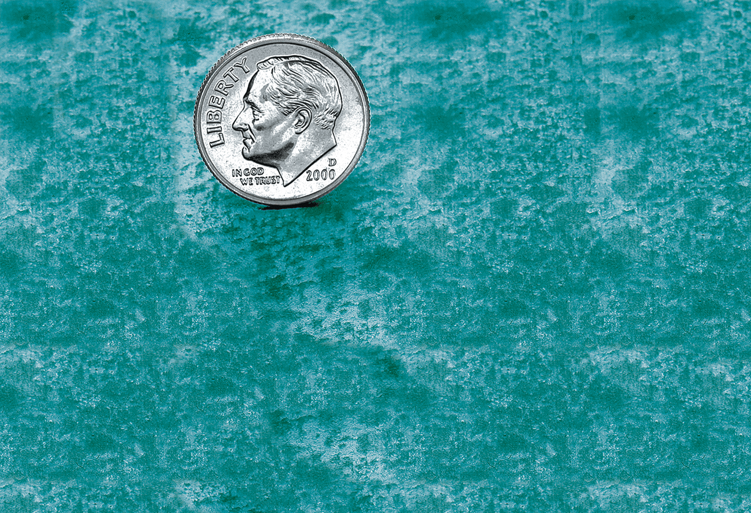 Sample of a turquoise bronze or brass patina finish for sign letters.