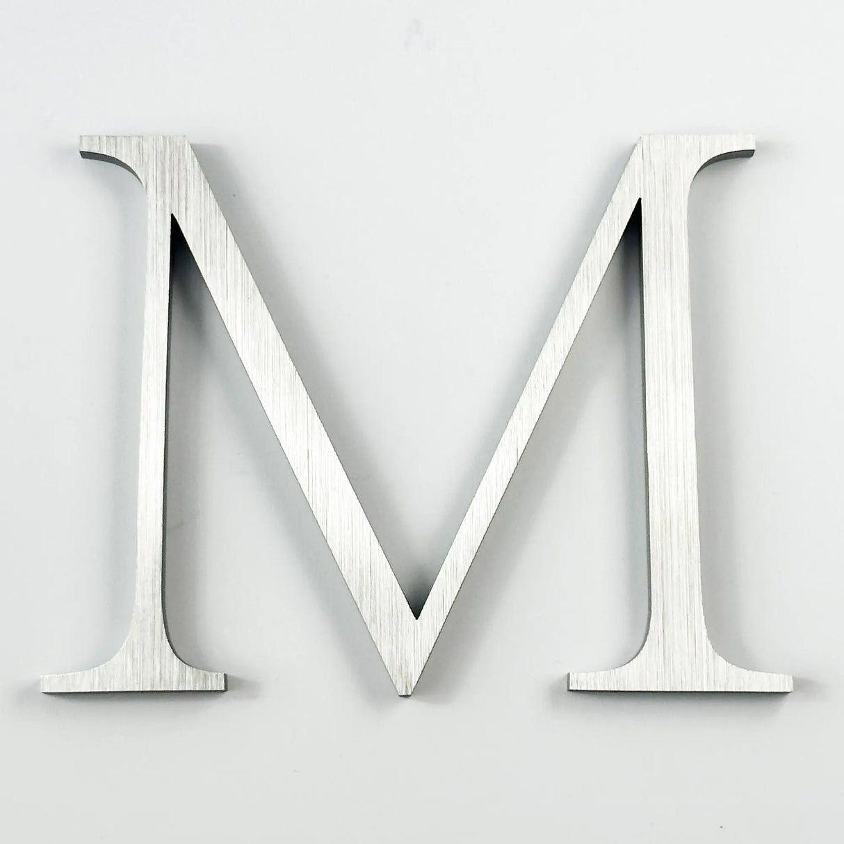 Vertically brushed solid 316 stainless steel division 10 architectural sign letter