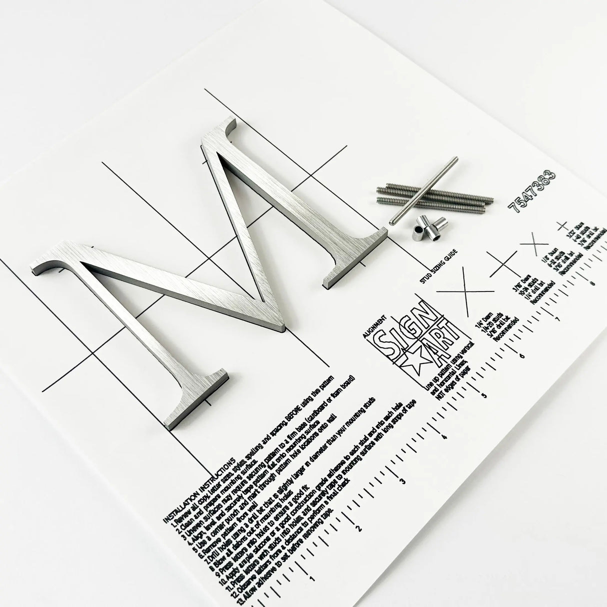 Brushed stainless steel division 10 architectural sign letter with back studs on mounting template