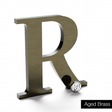 Aged brass sign letter R.
