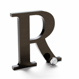 Flat cut bronze letter R with a dark aged finish.