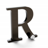 Flat cut bronze letter R with a dark aged finish.