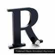 Polished black anodized aluminum sign letter R.