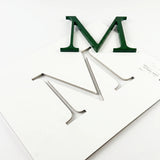 Painted acrylic division 10 architectural sign letter with double-sided tape on a mounting template