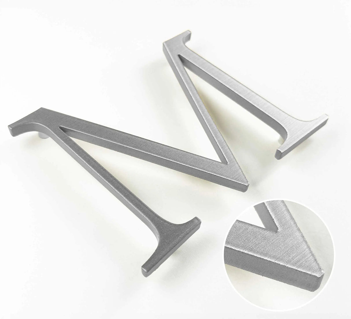 Horizontally brushed solid aluminum division 10 architectural sign letter with finish closeup