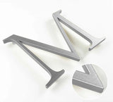 Horizontally brushed solid aluminum division 10 architectural sign letter with finish closeup
