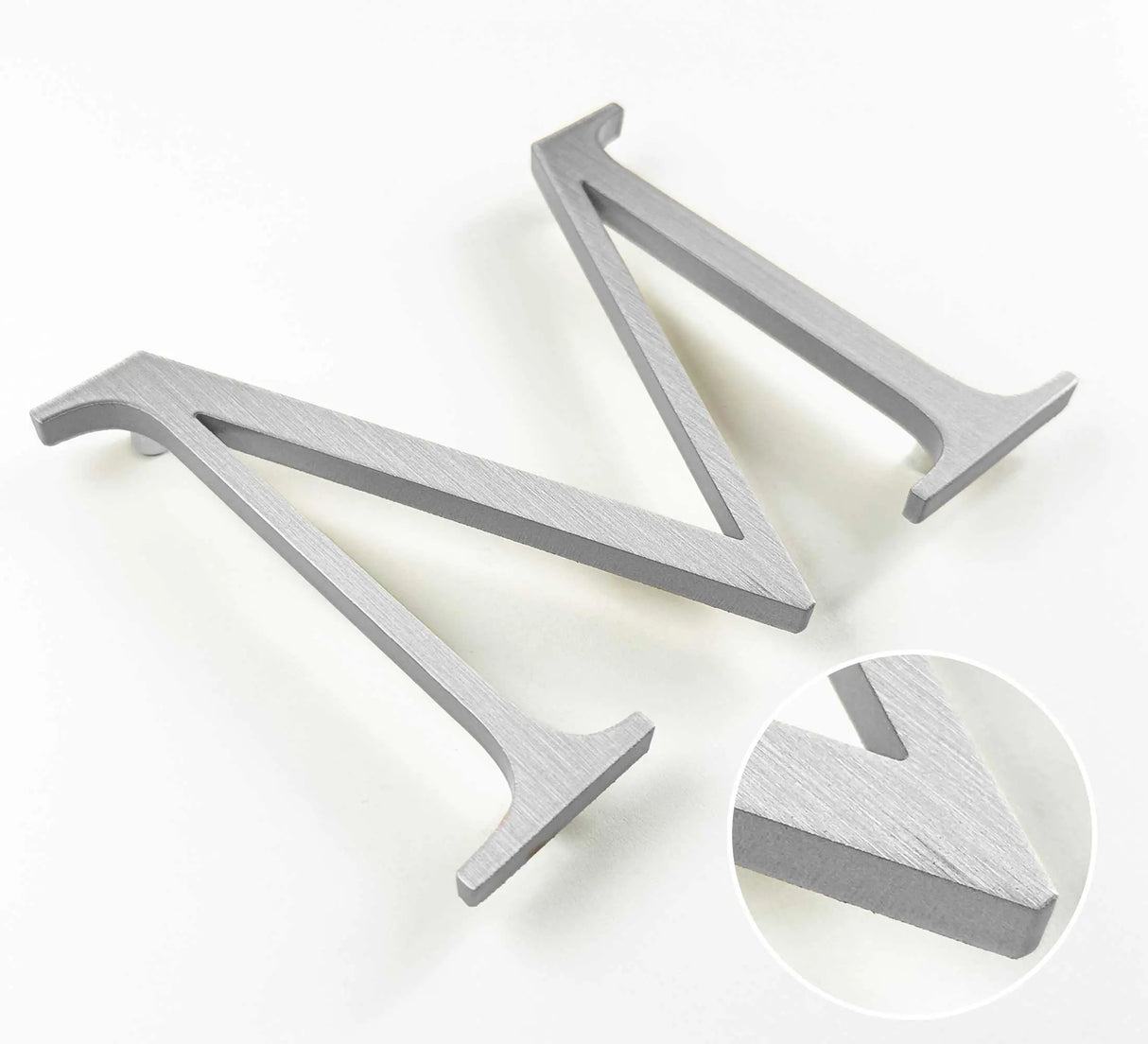 Vertically brushed solid aluminum division 10 architectural sign letter with finish closeup