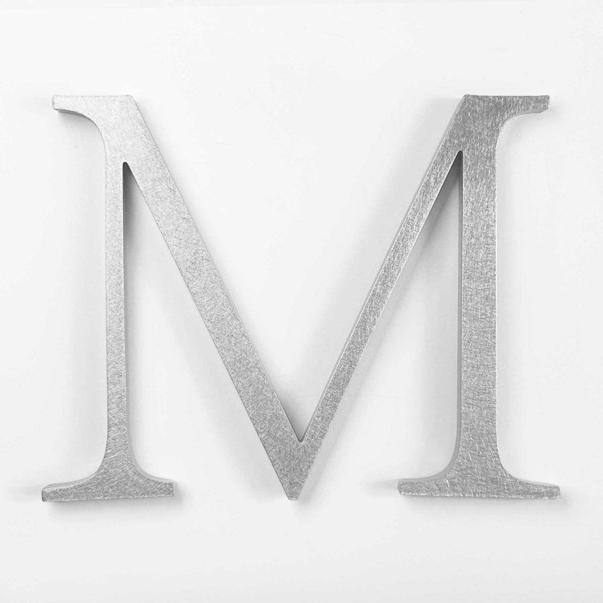 Orbitally brushed solid aluminum division 10 architectural sign letter