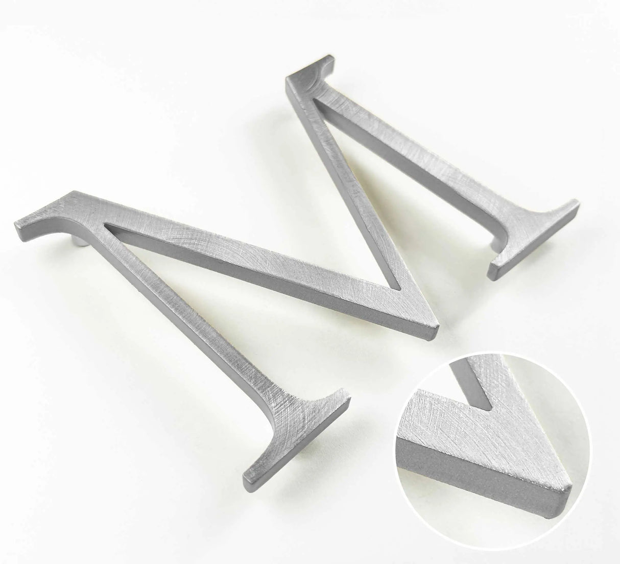 Random arc brushed solid aluminum division 10 architectural sign letter with finish closeup