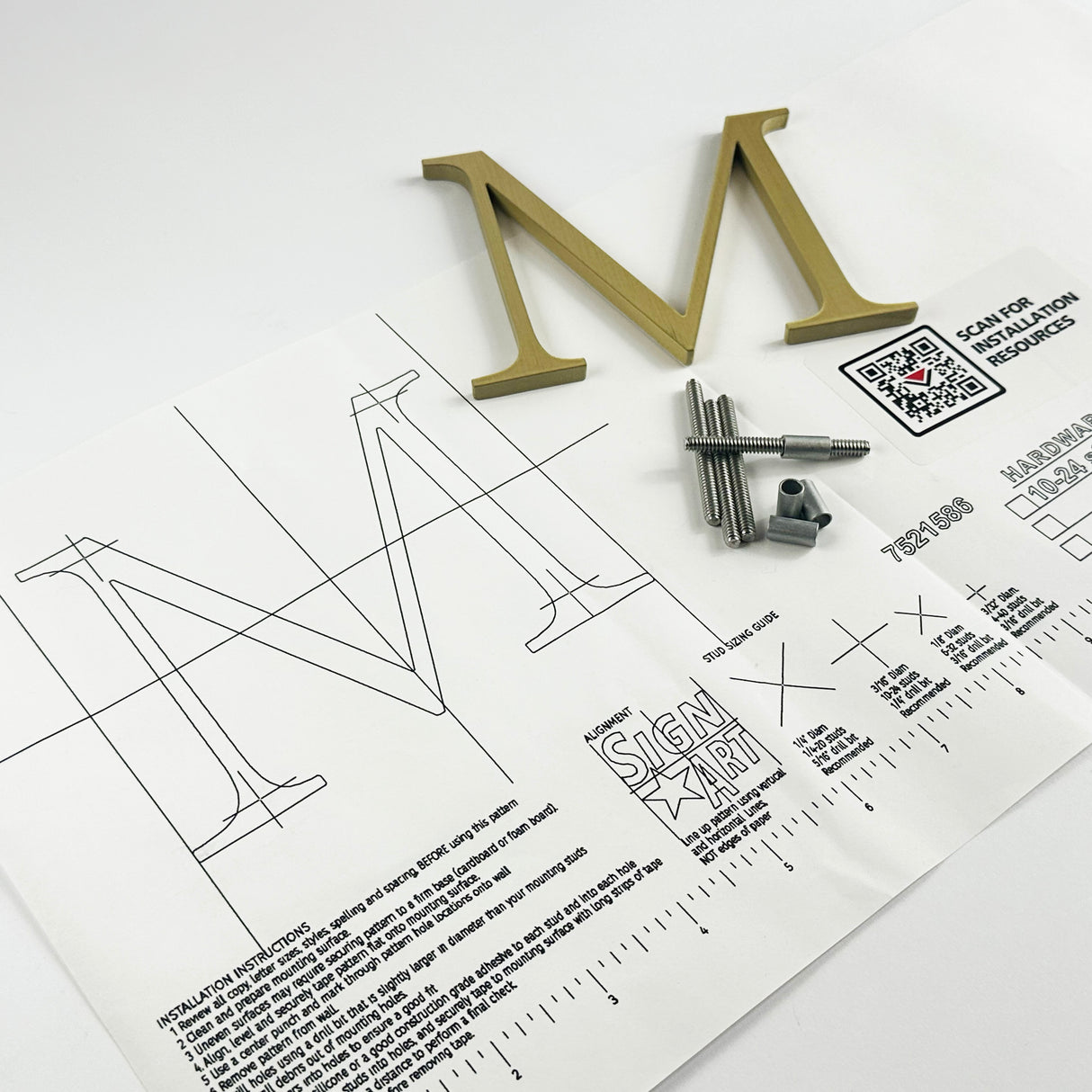 Brushed solid brass division 10 architectural sign letter on mounting template with hardware