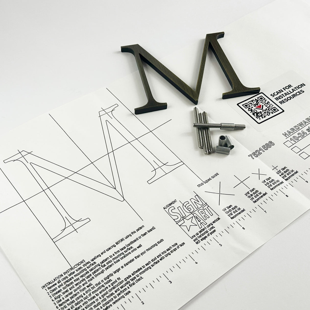 Aged solid brass division 10 architectural sign letter on mounting template with hardware