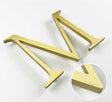 Vertically brushed solid BAA & BABA certified brass division 10 architectural sign letter with finish closeup