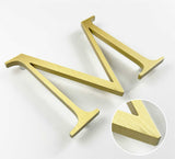 Vertically brushed solid BAA & BABA certified brass division 10 architectural sign letter with finish closeup