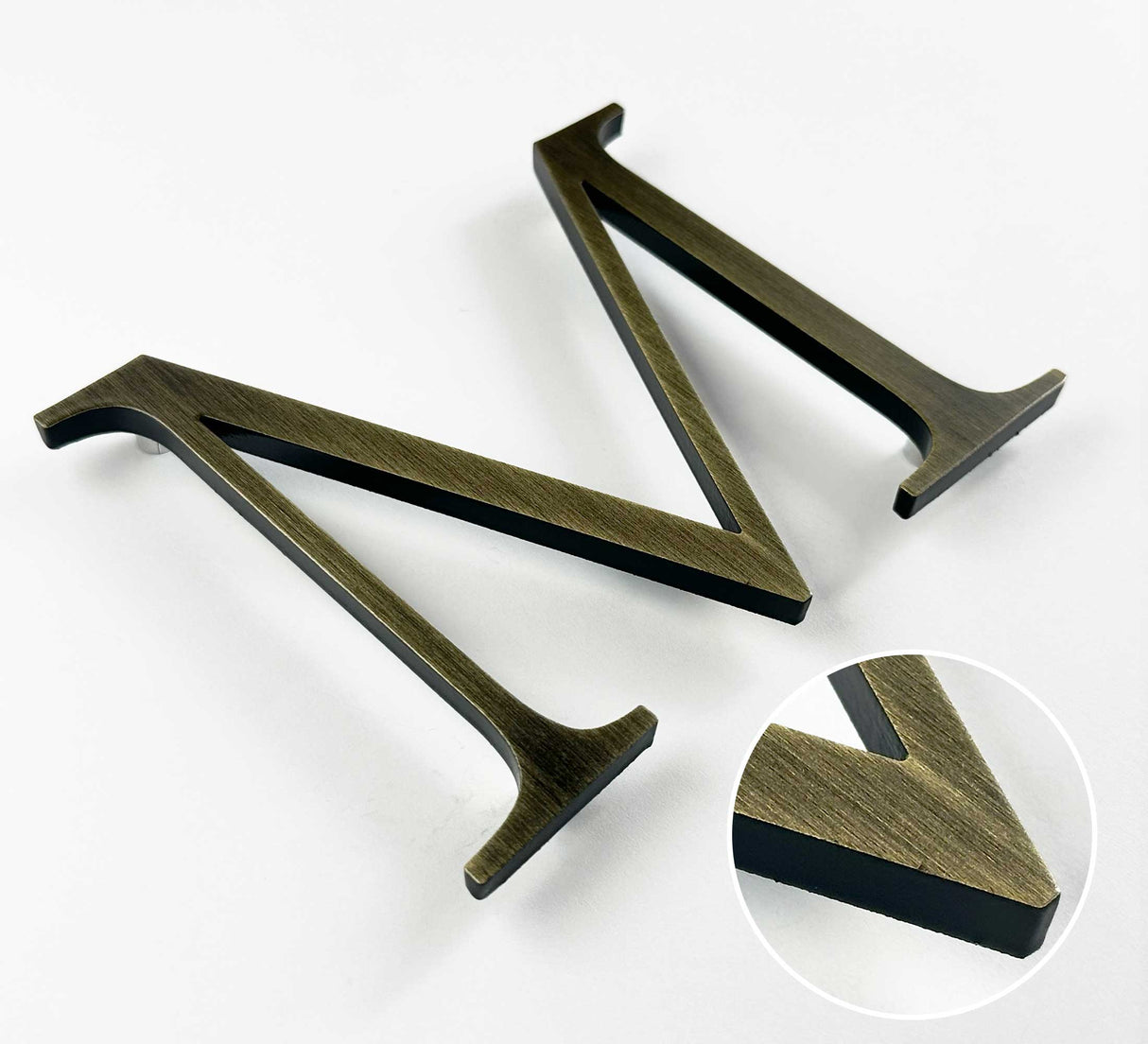 Heavily aged solid BAA & BABA certified brass division 10 architectural sign letter with finish closeup