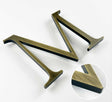 Aged solid BAA & BABA certified brass division 10 architectural sign letter with finish closeup