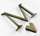Aged solid BAA & BABA certified brass division 10 architectural sign letter with finish closeup