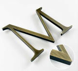 Aged solid BAA & BABA certified brass division 10 architectural sign letter with finish closeup