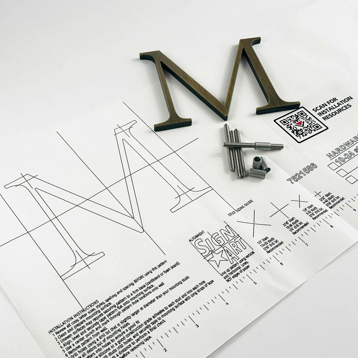 Lightly aged solid bronze division 10 architectural sign letter on mounting template with hardware