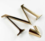 Polished solid bronze sign letter with finish closeup