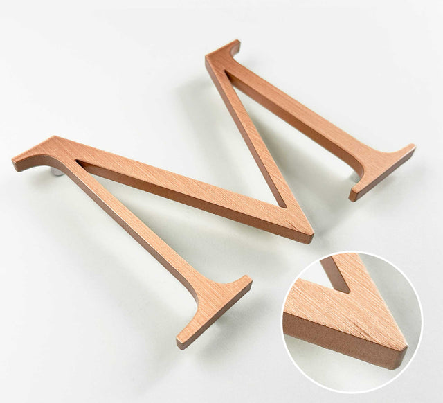 Vertically brushed solid copper division 10 architectural sign letter with finish closeup