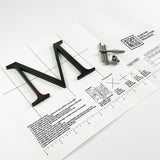 Dark alt oxidized solid copper division 10 architectural sign letter on mounting template with hardware