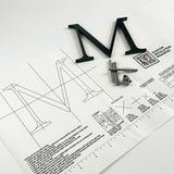 Dark alt oxidized solid copper division 10 architectural sign letter on mounting template with hardware